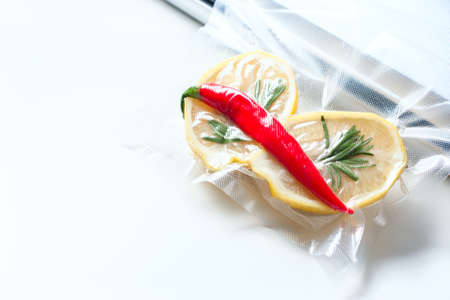 lemon in a vacuum package. Sous-vide, new technology cuisine. Sous-vide. Selective focusの写真素材