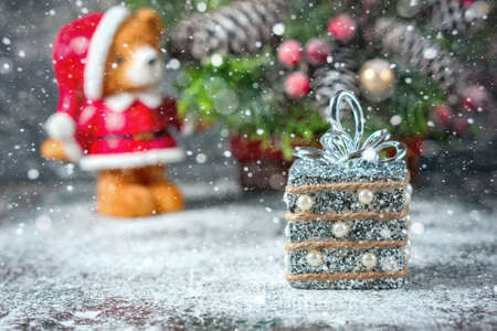 Silver and white xmas ornaments on rustic wood background. Merry christmas card. Space for text. Selective focusの写真素材