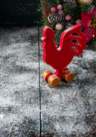 Wooden red rooster. New Year of rooster. Selective focus.の写真素材