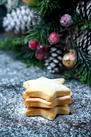 Homemade star shaped cookies on a wooden background. Christmas decoration. Selective focus