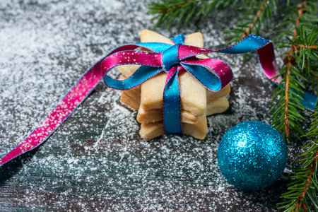 Homemade star shaped cookies on a wooden background. Christmas decoration. Selective focus