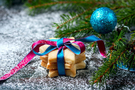 Homemade star shaped cookies on a wooden background. Christmas decoration. Selective focus