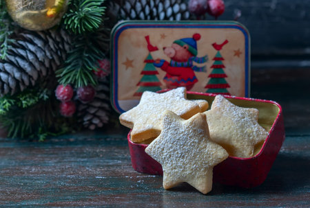 Homemade star shaped cookies on a wooden background. Christmas decoration. Selective focus