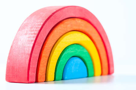 Rainbow, multicolored wooden eco toy. Isolated on whiteの写真素材