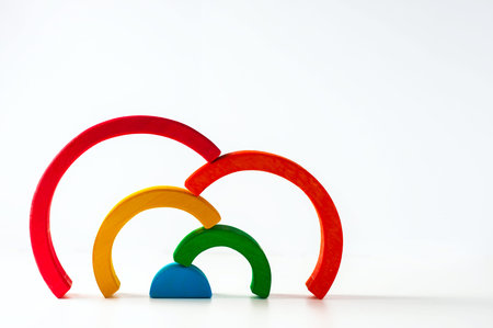 Rainbow, multicolored wooden eco toy. Isolated on white