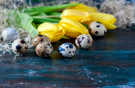 Easter composition, Quail eggs on the old wooden background. Soft focus