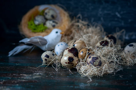 Easter composition, Quail eggs on the old wooden background. Soft focus