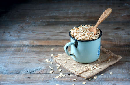 Oat flakes on a on wooden table, selective focusの写真素材