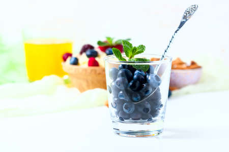 Fresh berries blueberry on a white background. selective focusの写真素材
