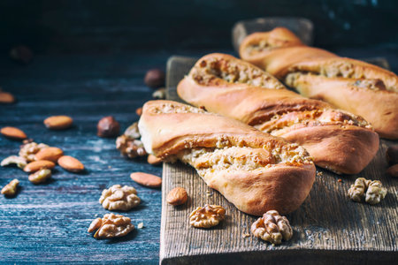 Sweet homemade rolls stuffed with walnut. Selective focus.