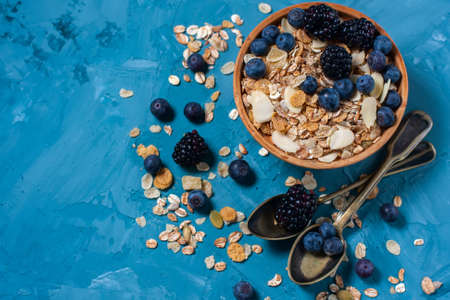 Granola with blueberries and blackberries. Healthy food.の写真素材