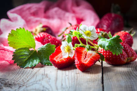 Fresh strawberries on a wooden background. Selective focusの写真素材