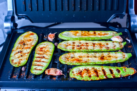 Grilled zucchini on a grill close-up. Selective focusの写真素材