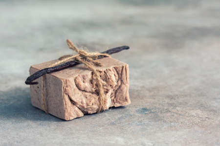 Organic handmade soap with vanilla on a concrete background, spa concept.の写真素材