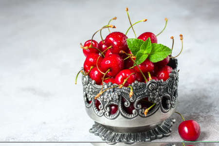 Juicy cherries with water drops, close up. Selective focusの写真素材