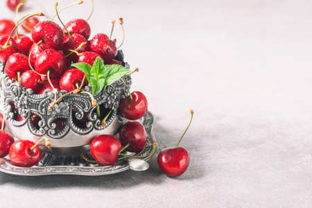 Juicy cherries with water drops, close up.の写真素材