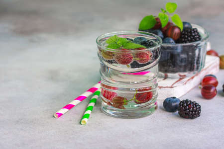 Carbonated drinks in glass with fresh berries. Selective focusの写真素材