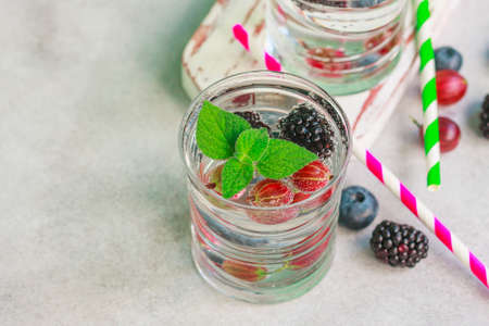 Carbonated drinks in glass with fresh berries. Selective focusの写真素材