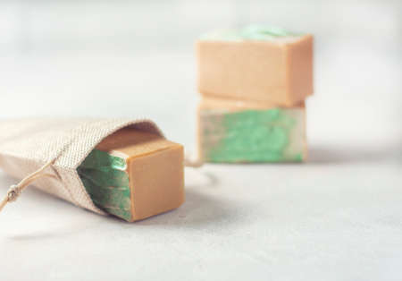 Organic handmade soap and a linen sack. Selective focus. Place for text.の写真素材