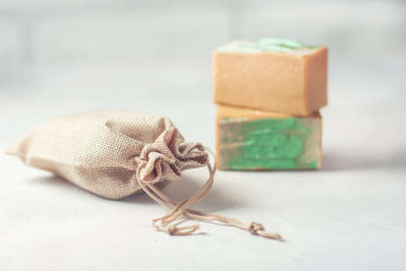 Organic handmade soap and a linen sack. Selective focus. Place for text.の写真素材