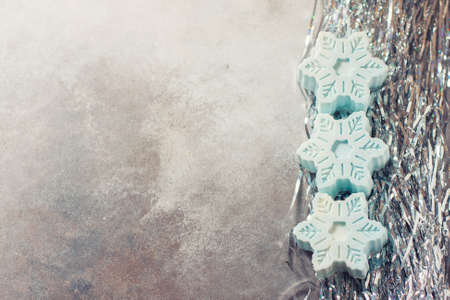 Handmade soap in the form of snowflakes, natural cosmetics concept. Place for text. Selective focusの写真素材