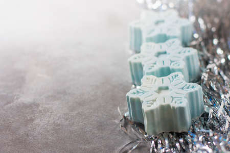 Handmade soap in the form of snowflakes, natural cosmetics concept. Place for text. Selective focusの写真素材