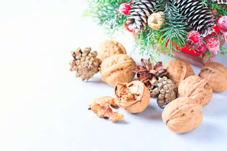 Christmas composition. Pine tree branches, pine cones, fir cones, nuts Selective focusの写真素材