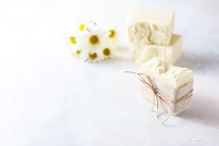 Natural handmade soap with chamomile, the concept of spa and health.の写真素材