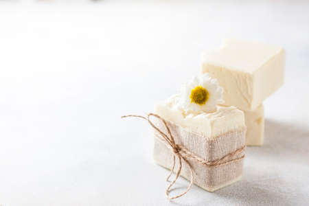 Natural handmade soap with chamomile, the concept of spa and health. Selective focusの写真素材