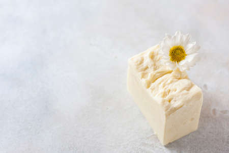 Natural handmade soap with chamomile, the concept of spa and health.の写真素材