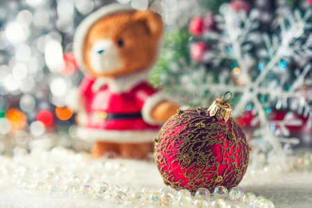 Christmas red ball on artificial snow, defocused background, selective focusの写真素材
