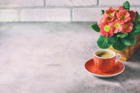 Close-up of hot coffee, moka-pot and flowers.の写真素材