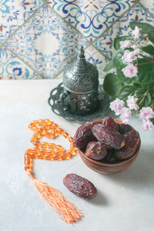 Dates fruit and rosary still life. Selective focusの写真素材