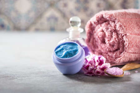 Spa. Natural cream, sea salt, flowers and a towel. Copy background space. Selective focusの写真素材