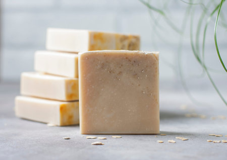 Handmade soap bars with oatmeal flakes. Organic soap making. Spa treatments. Selective focus