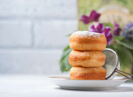 Homemade classic donuts on a light background. Breakfast concept. Copy space. Selective focusの写真素材