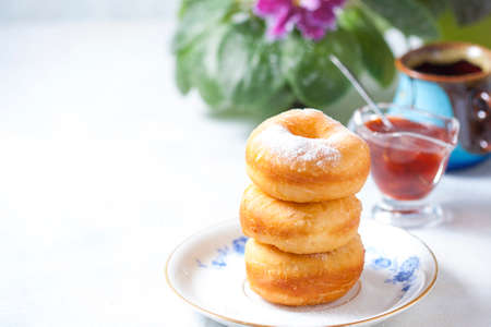 Homemade classic donuts on a light background. Breakfast concept. Copy space. Selective focusの写真素材