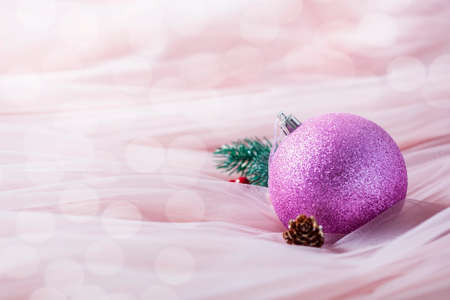 Christmas pink decorations on pastel pink background. Christmas decoration background. Selective focusの写真素材