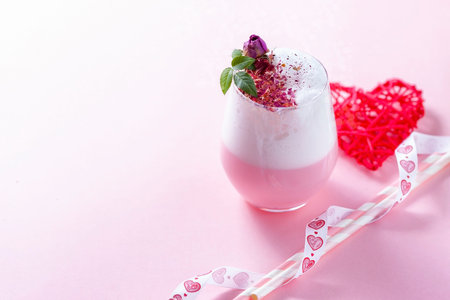 Pink Latte Tea. Pink hibiscus latte. Fashionable romantic drink. Dry flowers of roses. Pink...