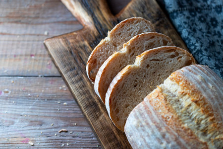 Homemade loaf of freshly backed sourdough bread. Selective focus, copy spacy.