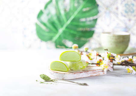 Japanese ice cream Mochi with matcha tea, in rice dough. Traditional Japanese dessert on white background. Selective focus, copy spaceの写真素材
