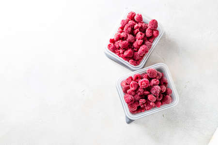 Frozen raspberry close up on a light background. Top view, copy space. Fresh organic berries macroの写真素材