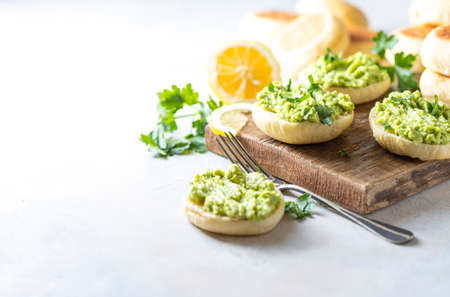 Fresh Homemade English Muffins with Avocado. Breakfast, morning concept. Selective focus, copy spaceの写真素材