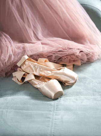 Ballet pointe shoes and tutu skirt. Distant training with, social distance or self-isolation, online education concept. Copy space, selective focusの写真素材