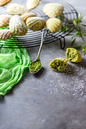 Madeleine homemade cookies with matcha tea. Selective focus, copy space.の写真素材