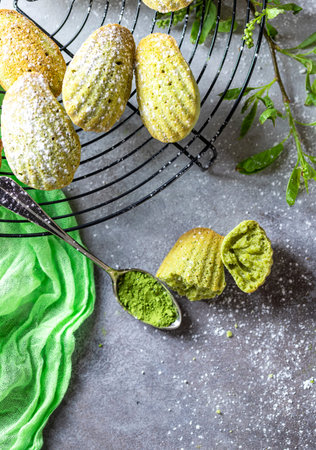 Madeleine homemade cookies with matcha tea. Selective focus, copy space.の写真素材