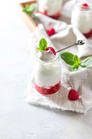 Fermented drink kefir, yogurt in a glass jar on a light background. Probiotic cold fermented dairy drink. Copy spaceの写真素材