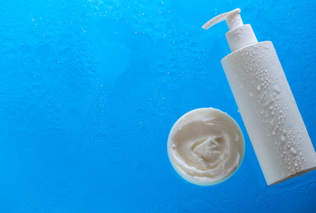 Cosmetic cream on background with a water pool. Cealthcare and medicine concept. Top view.