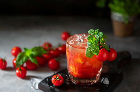 Ice tomato juice in a glass goblet. Selective focus.の写真素材