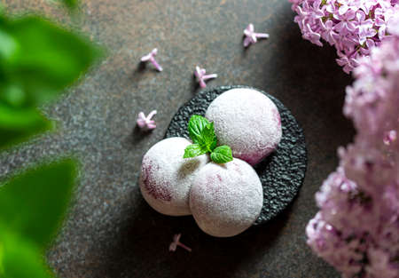Homemade Purple Ube Ice Cream. Japanese Moti ice cream in rice dough. Traditional japanese dessert on a white background. Selective focus, copy spaceの写真素材
